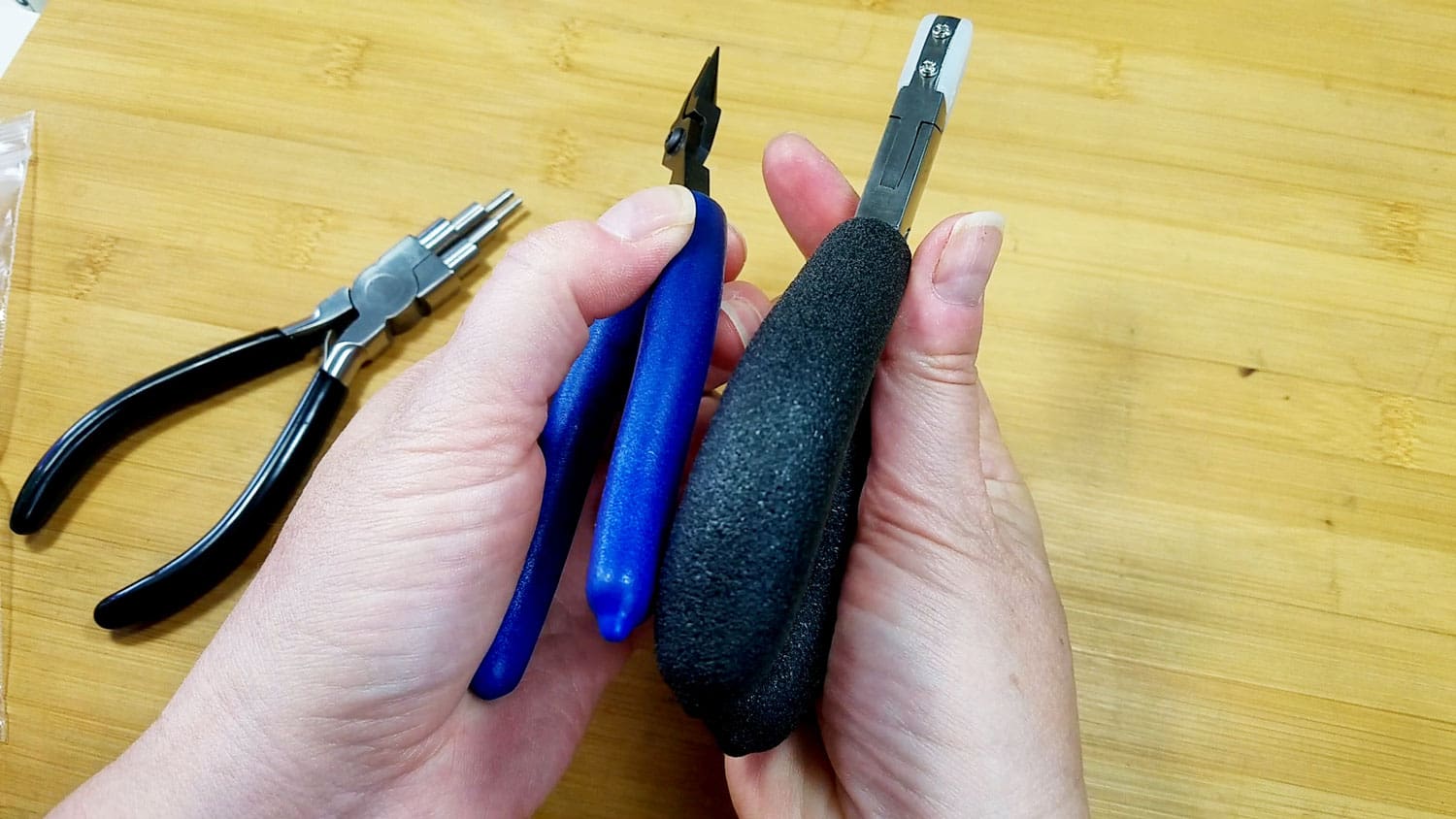 An image showing a side-by-side comparison of the grips on the author's professional grade Swanstrom pliers and her nylon jaw pliers after the new comfort grips were applied.