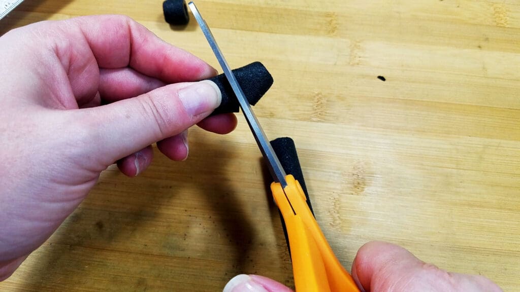 An image showing the author trimming her cushion grips to length.