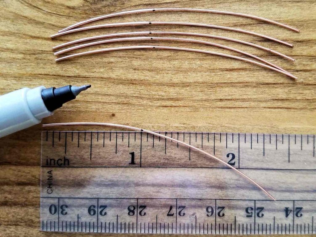 Step 1 - Cut six pieces of 24ga half-hard wire to 2-1/2-inches long. Mark each wire at 1 inch from one end, as shown. 