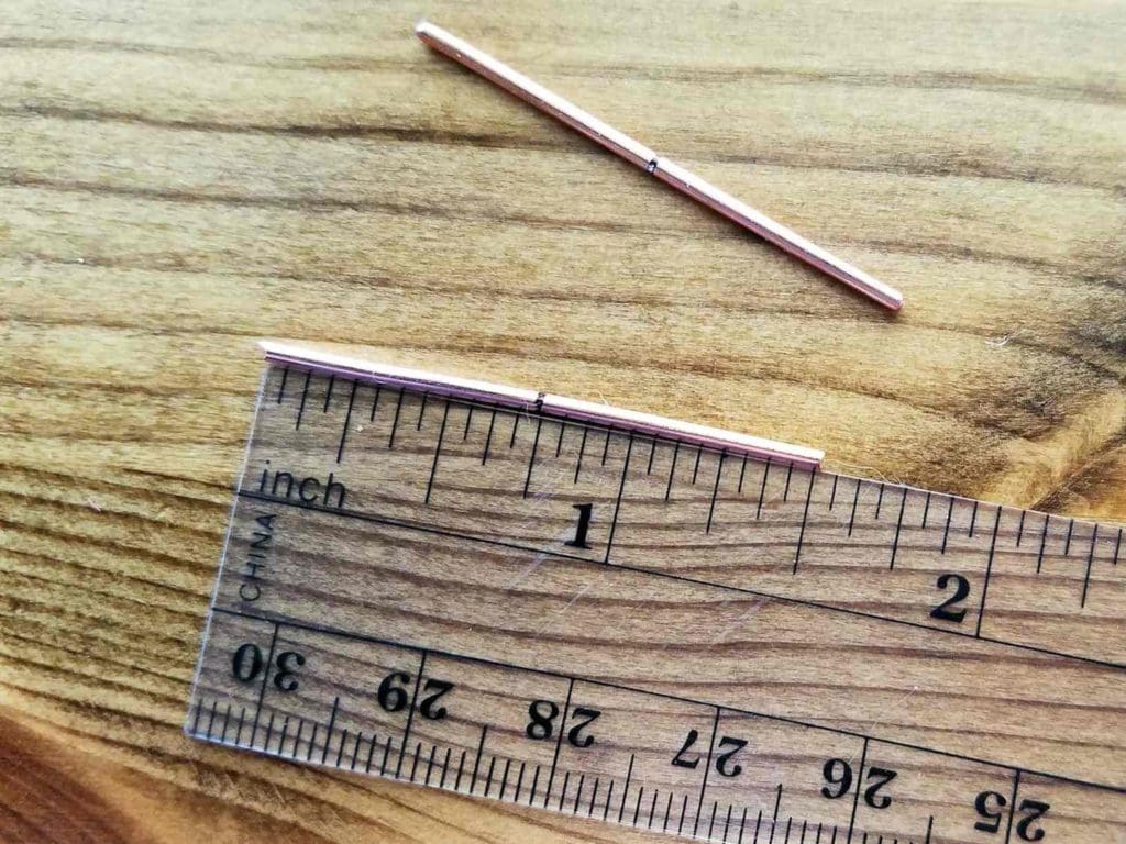 Step 1 - Measure and cut two pieces of 16ga wire 1.5 inches long. Mark the center points of your two core wires, as shown.