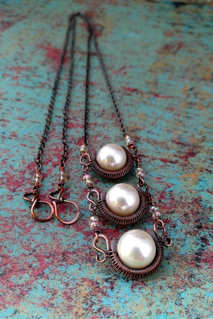 The Chalice Necklace bead frames can be modified to accommodate almost any size or shape of round bead. The sample shown here is a dainty variation of the Chalice Necklace featuring 12mm Swarovski pearls and 2mm x 3mm crystal roundels on a delicate chain finished with a small Infinity Clasp.