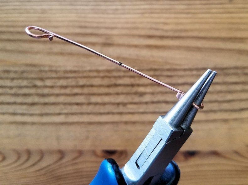 Core Wires Step 8 - Continue forming the same 18ga core wire with your round nose pliers, as instructed. The wire should look like the one shown here when complete.