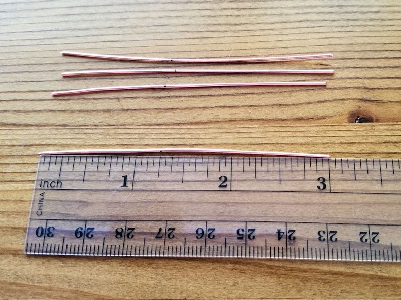 Pendant Step 1 - Measure and cut four pieces of 20ga wire, as instructed. Mark the center point of each wire, as shown.