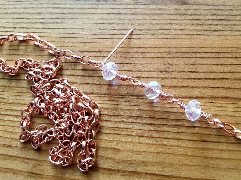 Chain Step 6 - Attach your loose chain to the last loop on the beaded connectors just added, as shown. 