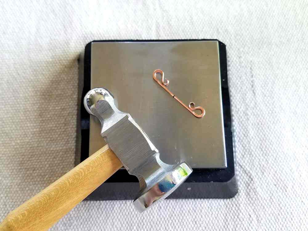 Delicate Bar Pendant, Step 5: Work harden Wire 1 using a chasing hammer and bench block
