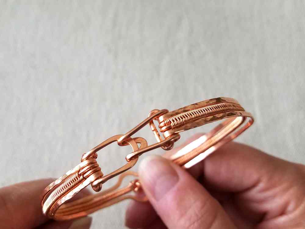 Test the clasp and make any final adjustments by hand. Your Lover's Knot Stacked Bangle bracelet is now complete and ready to finish!