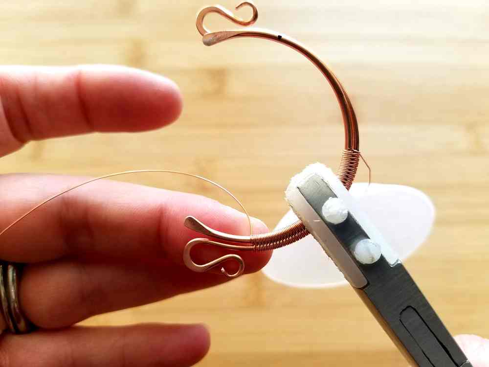 Step 3 - Starting from the bottom center of the two core wires, begin weaving the two wires together using the Modified Soumak weave.