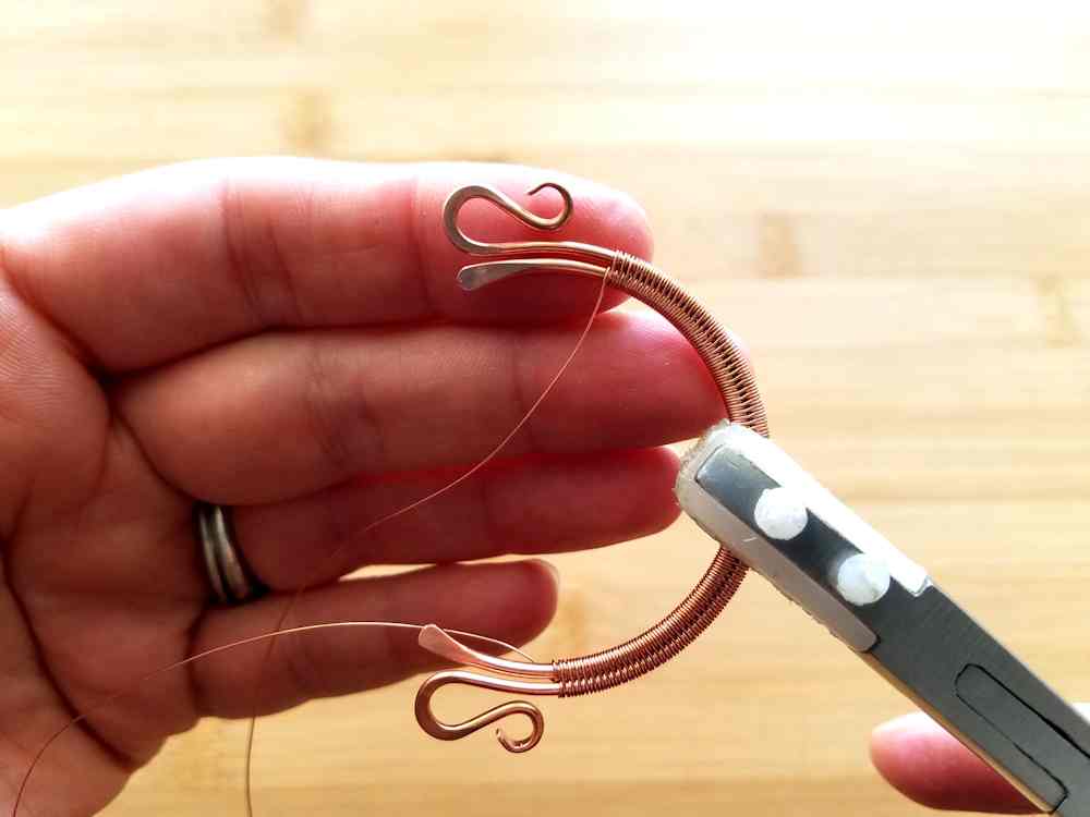 Step 4 - Once you reach the first mark that you made in Step 2, flip the bead frame over and begin weaving in the other direction. Stop at the second mark that you made in Step 2.