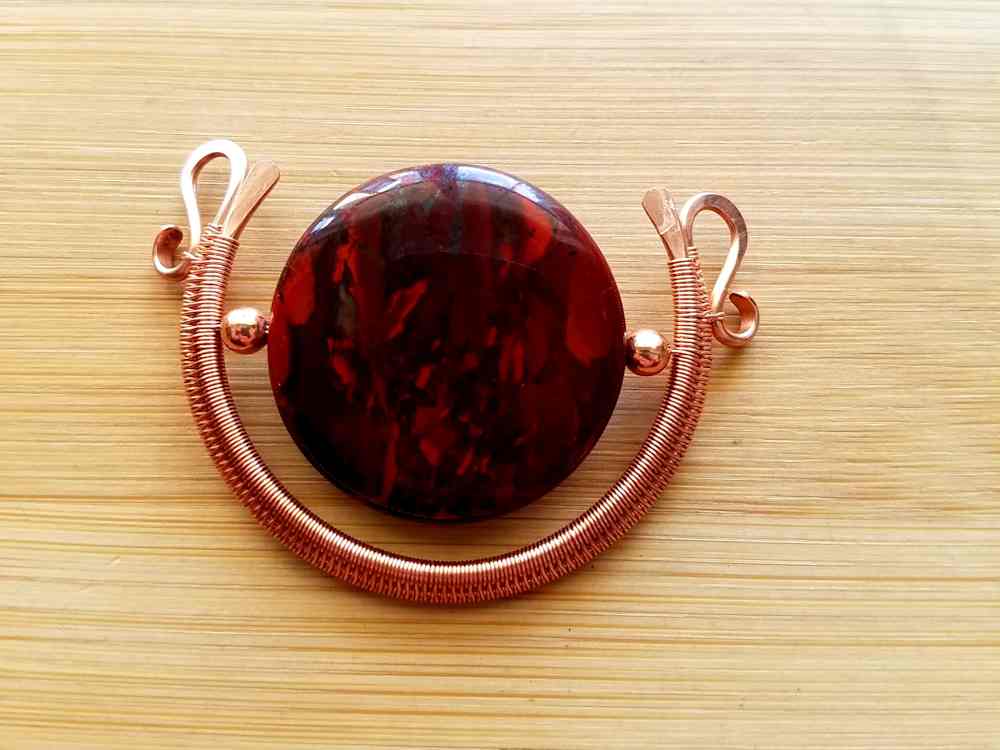 Your pendant is now complete and ready to hang on a chain. Make any final adjustments now so your pendant looks like the one shown here.