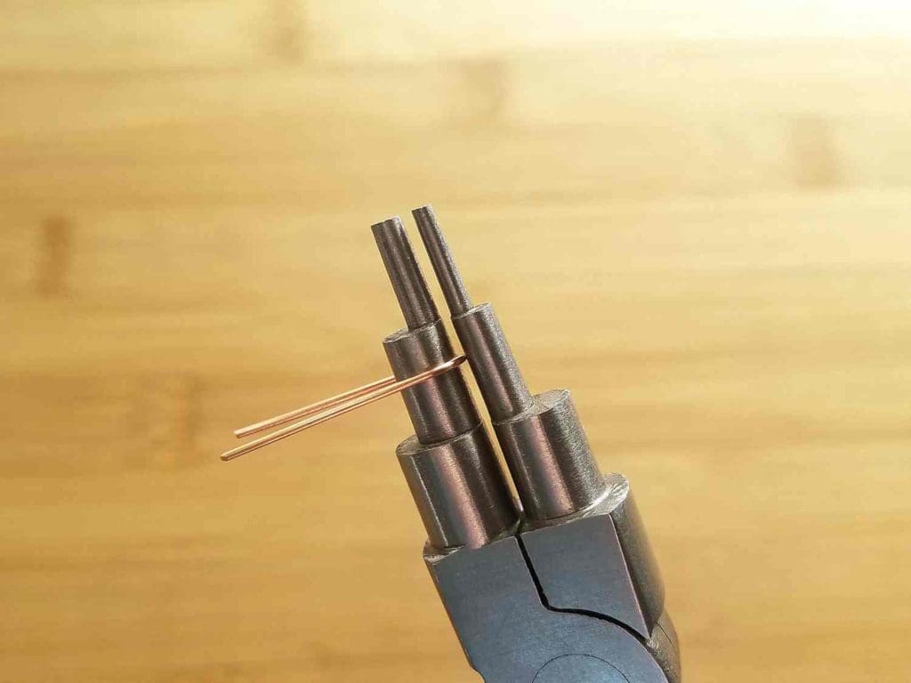 Step 2 - Form the first core wire into an elongated U shape, using the 6mm step on your bail-making pliers, as shown.