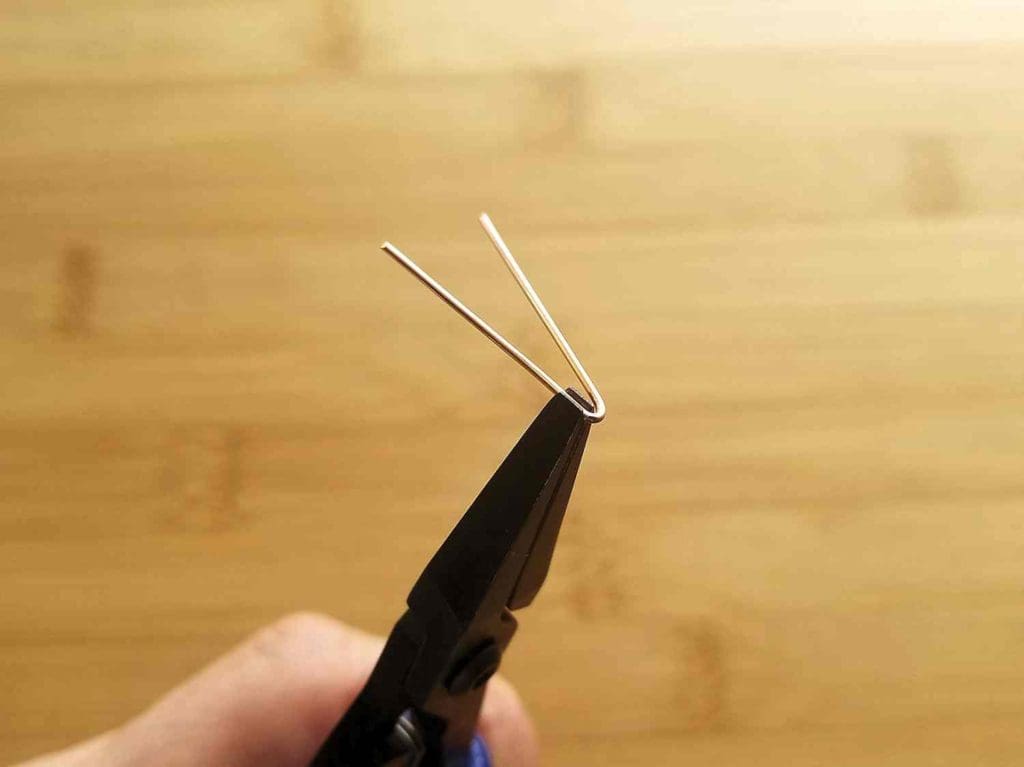 Step 4 - Begin forming Wire 3 using your flat nose pliers, as shown.