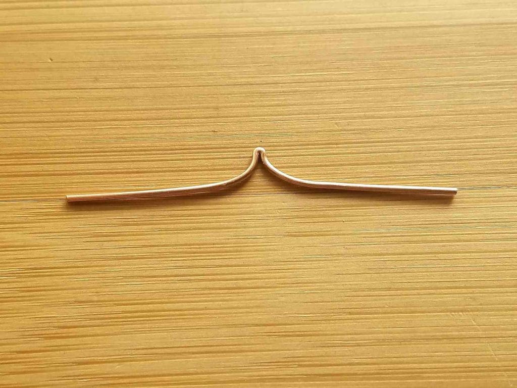 Step 7 - When the fold is opened, your wire should be relatively straight with a sharp peak in the center, as shown.