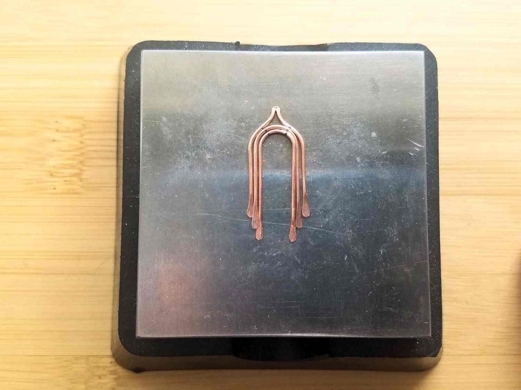 Step 12 - Use a chasing hammer and bench block to paddle the ends of all three wires and the peak of Wire 3, as shown.