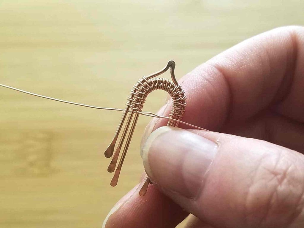 Step 3 - Incorporate Wire 3 into the weave, as shown, and complete about six full weave pattern repeats to secure Wire 3 in place.