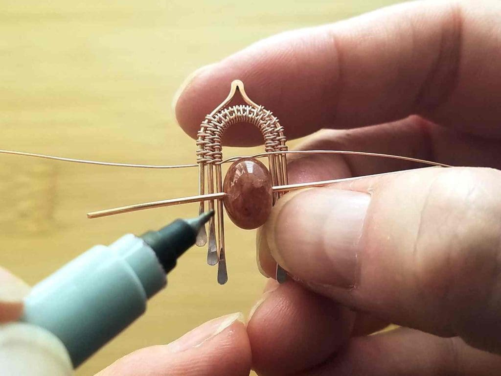Step 4 - Determine and mark the focal bead's hole position on Wire 1, as described. 