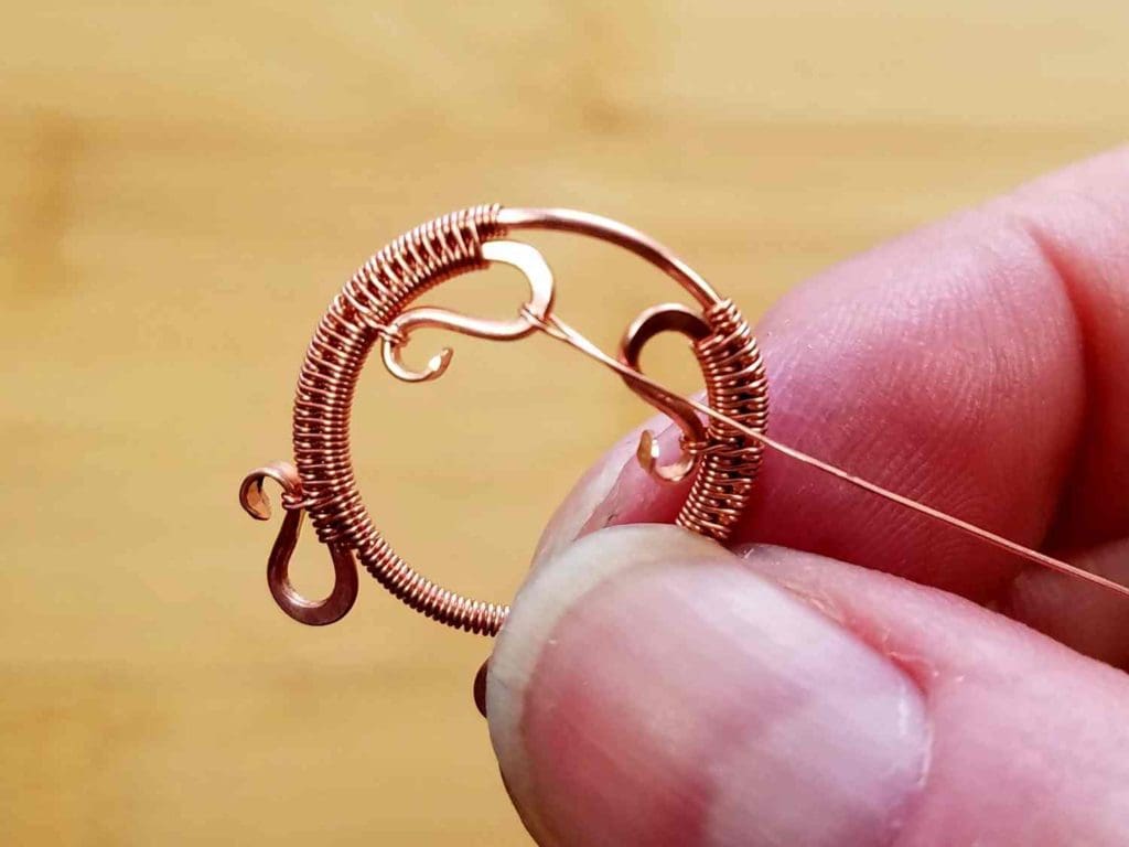 Beads Step 2 - Wrap your suspension wire twice around one curved end of Wire 1, as shown. 