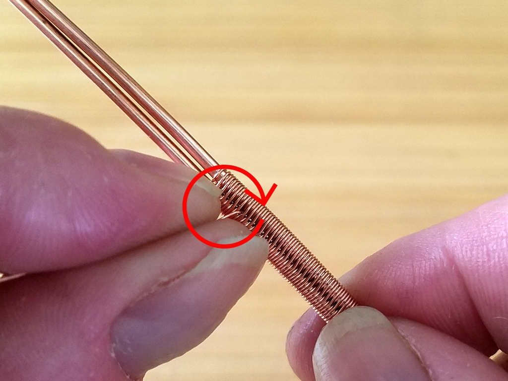 Step 4 - Break the wire tails on either side of your splice by pulling the tail taught with your fingers and swirling it around in a small circle until the wire work hardens and breaks, as shown.