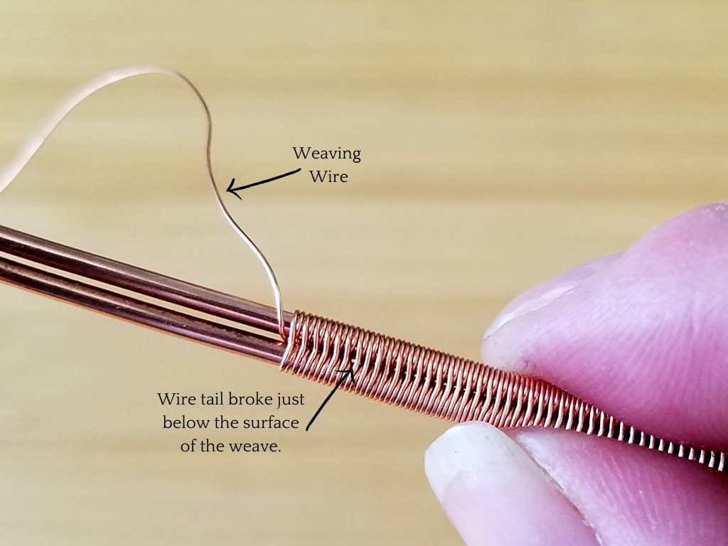 This image shows the splice after breaking the two weaving wire tails. The only visible indication that the wire was spliced is that the broken point of the tail can just be seen under magnification, as shown. The weave appears seamless with the naked eye. 