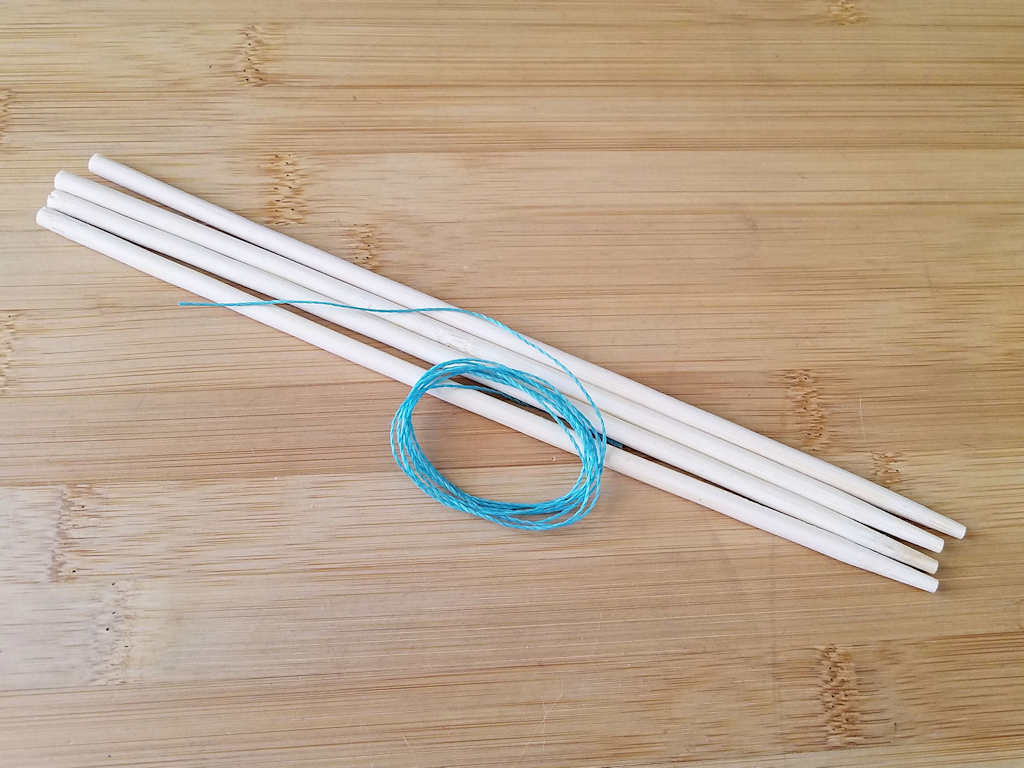 I'm using simple wood chopsticks and waxed jewelry cord in a contrasting color to demonstrate the Modified Soumak increase and decrease techniques. Those materials are shown in this image. 