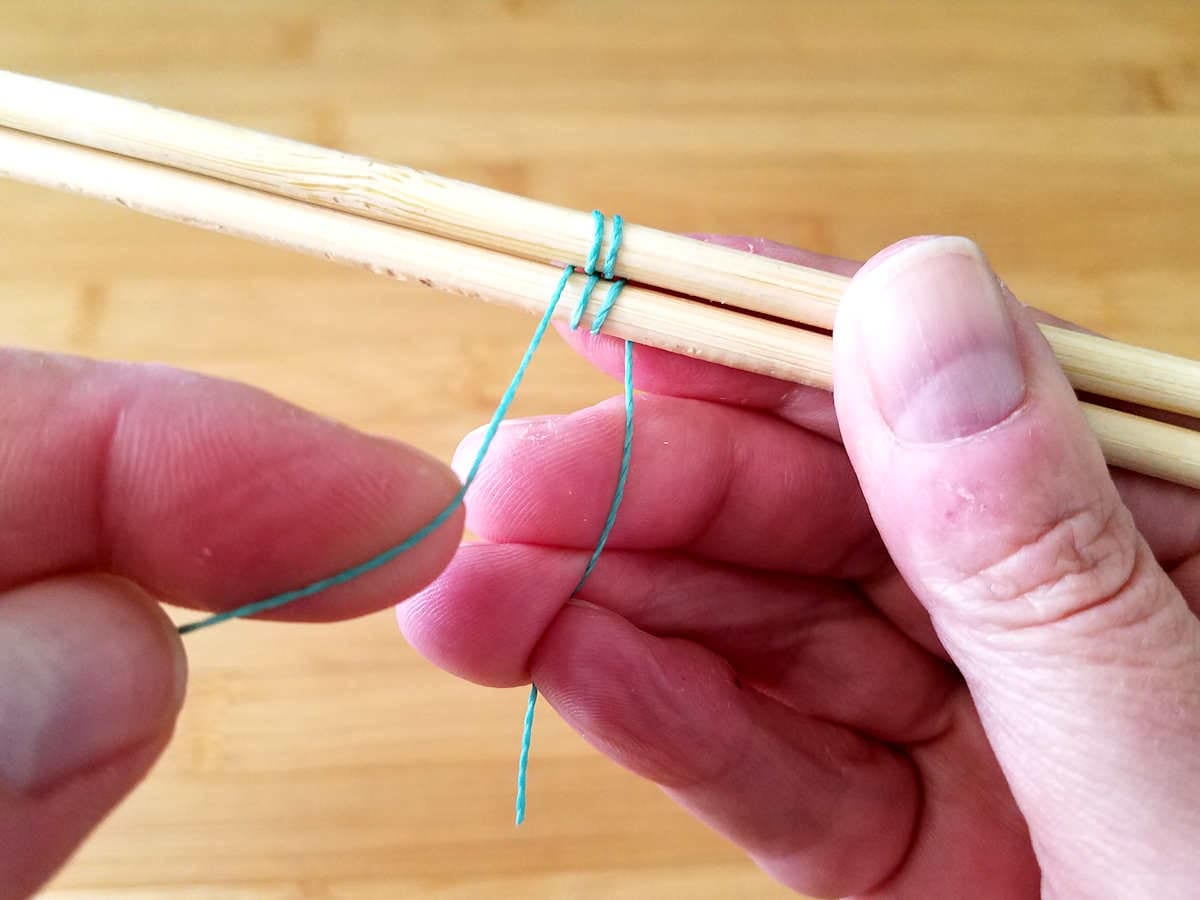 In this image, I've completed two full pattern repeats. This is indicated by the fact that there are two wraps on each of the two core wires, and the weaving wire is in position to begin the next pattern repeat. 