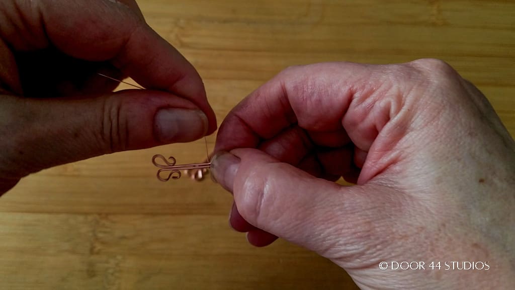 Step 7 - Secure the weaving wire to one side of the folded wires.