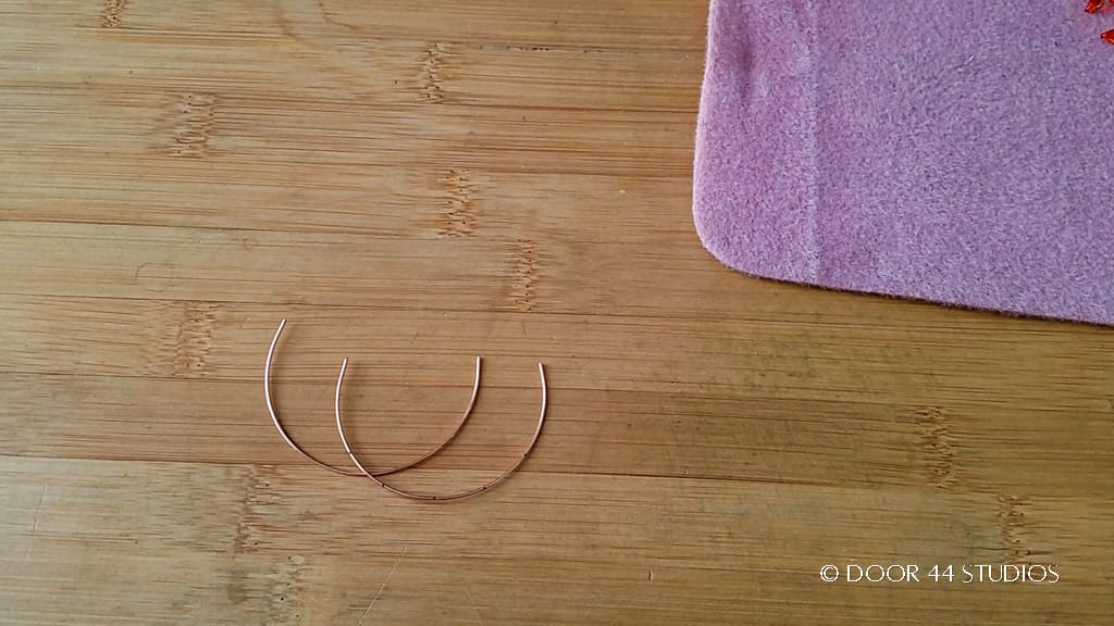 Step 11 - Form the two marked wires into soft curves using a large round object. When finished, the wires should look like those pictured here.