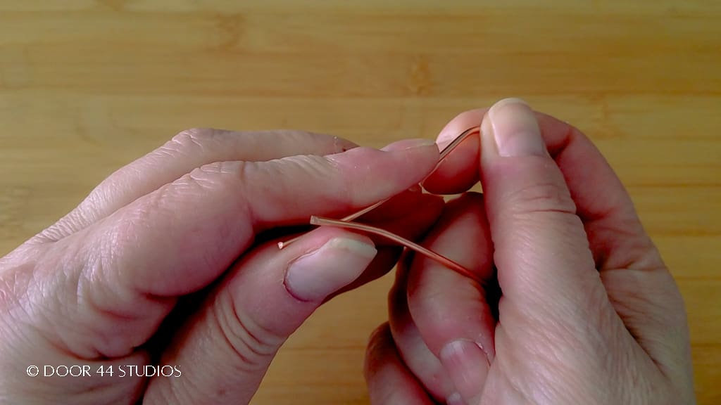 Step 4: Use your fingers to softly curve the cut ends of the wires, as shown.