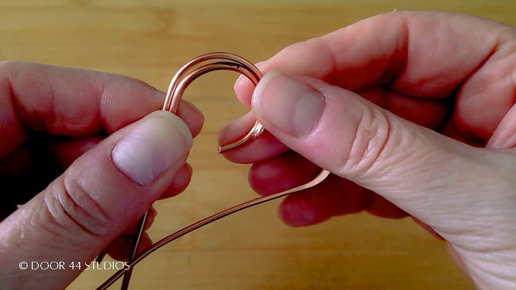 Testing the fit of the second core wire within the heart-shaped frame 