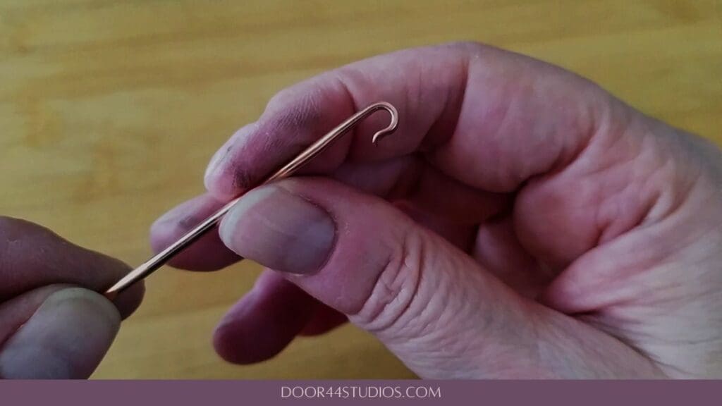 The finished hook should remain open, as shown, to facilitate attaching it to the circlet