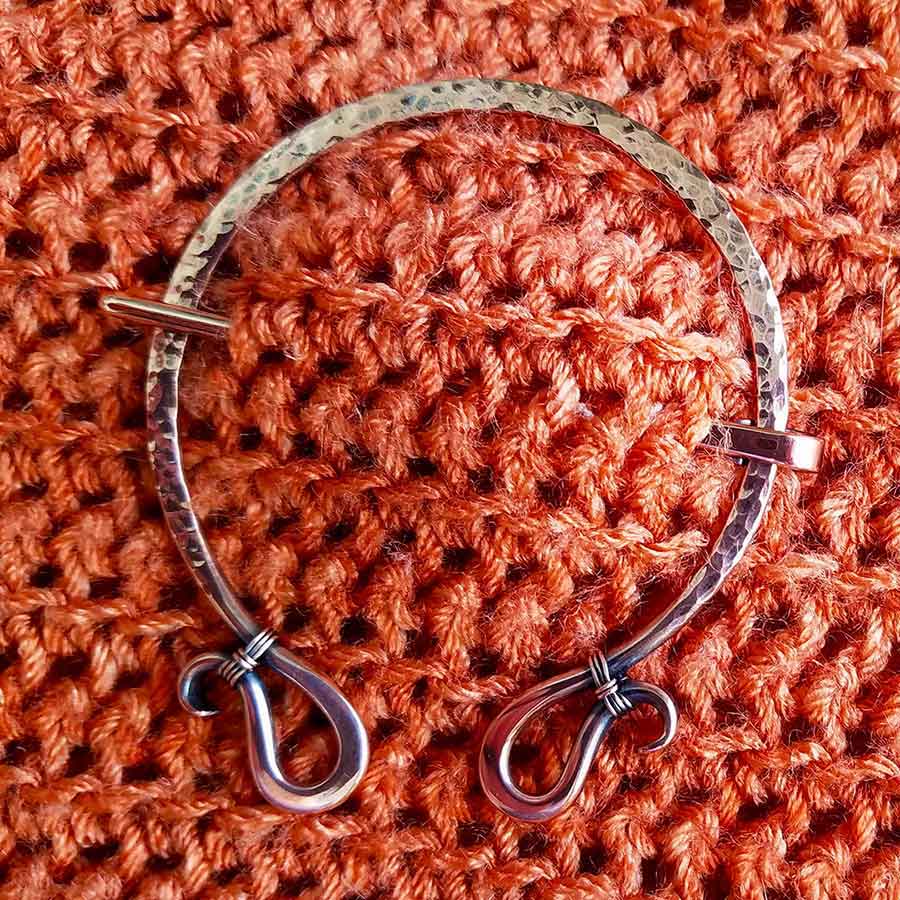 Quick, easy sweater pin - a hammered copper brooch worn on a crochet garment