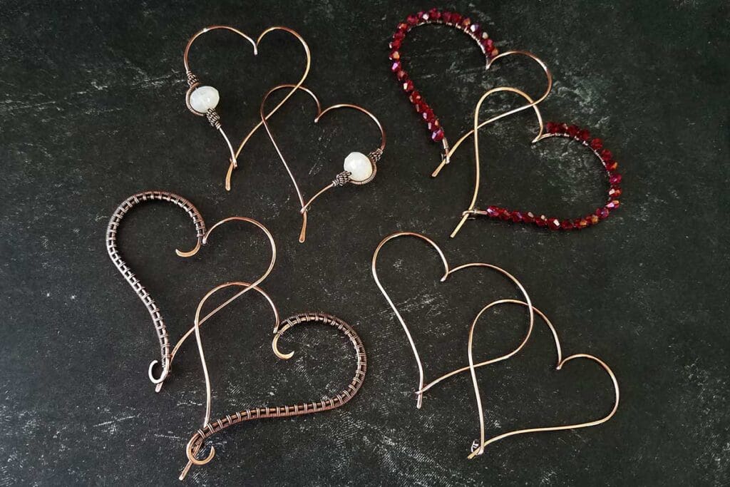 The simple heart hoop earrings along with three simple variations that can be easily made using this basic earring design